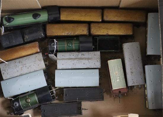 A collection of Hornby Meccano and Marx 0-gauge tinplate locomotives and rolling stock,